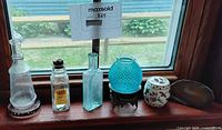Group view of all six items lined on windowsill