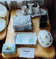Group shot of all porcelain and metal items on table