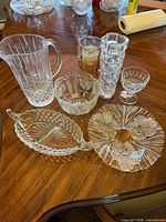 Group view of all seven crystal and glass pieces on table
