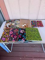 All eight albums arranged on table for count and pattern overview