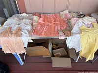 Overview of all garments on table showing quantity and variety