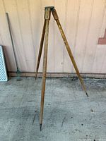 Full view of tripod standing with legs extended