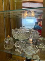 Overall view showing serving bowl, candy dish, bud vase, small dish and figurines