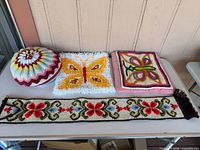 All four handmade items arranged on table for overview