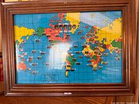 Full view of framed world time clock