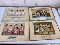Group view of all four Dionne Quintuplets calendars laid flat