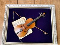 Violin, bow, sheet music and frame overview