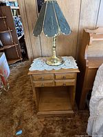 Nightstand with lamp on top showing overall design