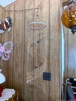Full view of hanging spiral beaded mobile showing overall design