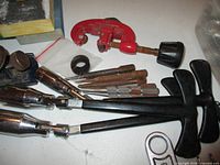 Overview of lot showing clamp tools, sockets, bits and tubing cutter