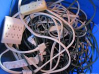 Close view of tangled cords and two power strips