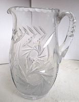 Full view of cut crystal pitcher showing overall form and pattern
