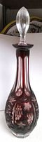 Full view of decanter showing ruby overlay and cut patterns