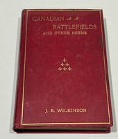 Front cover showing title, author name, gilt details, red cloth binding