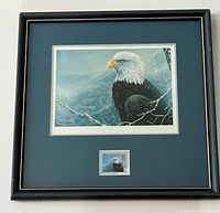 Full view of framed print showing artwork, matting, stamp, and frame