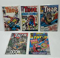 Group shot of all five bagged Thor comics laid out