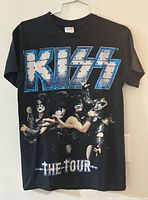 Front view of T-shirt showing logo and band graphic