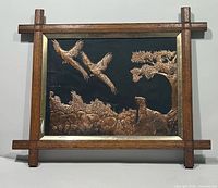 Full view of framed copper relief artwork