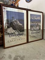 Both framed advertising mirrors side-by-side in setting