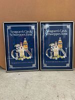 Front view of both framed advertising signs