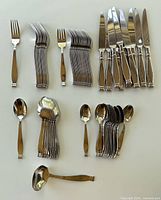 All 41 flatware pieces laid out by type