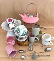 Full assortment including teapot, cups, mugs, bowls and infusers