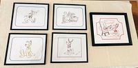 Front view of all five framed sketches arranged on surface