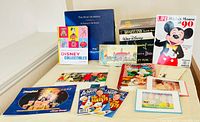 Group shot of all books, magazine, CD box, prints and postcards