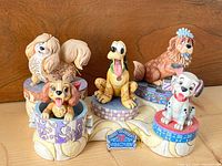 Full set of five dog figurines on bone base with plaque visible