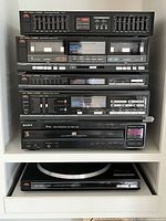 Full stack showing all six components installed in shelving