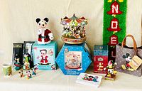Full lot overview with boxes, ornaments, carousel, tree topper and wall hanging