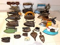 Group shot of all irons and trivets on countertop
