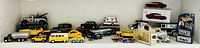 Shelf containing all loose and boxed toy vehicles