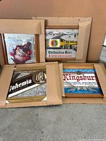 All four framed beer mirror signs grouped