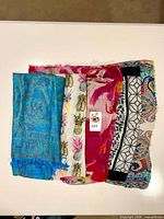 All five folded scarves displayed