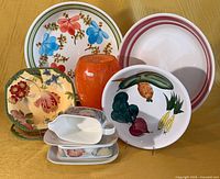 Group shot showing all eight assorted ceramic and glass dinnerware pieces