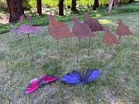 Group shot of all lawn stakes and butterflies displayed on grass