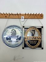 Both glass signs hanging on wall showing overall view