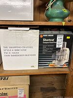 Retail boxes for both appliances on shelf