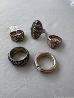 Group shot of all five sterling rings