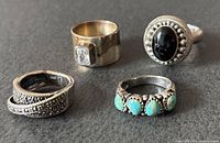 All four sterling silver rings displayed together