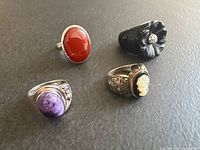 Group shot of all four sterling silver rings