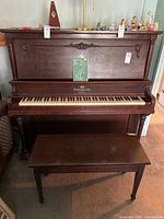 Full view of Heintzman & Co. upright piano with Thomas High Grade bench in front