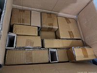 Large cardboard box containing multiple smaller original packaging boxes for porcelain dishware set