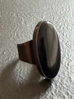 Front view of ring showing black oval obsidian and bezel