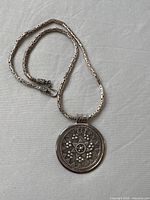 Full view of sterling silver necklace with pendant