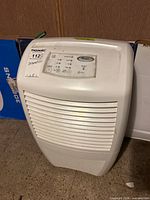 Front view showing control panel and louvered intake of Whirlpool Gold dehumidifier