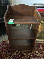 front view of wooden three-shelf unit