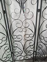 close view of scrollwork metal panel