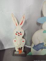 Slim painted wood bunny on base